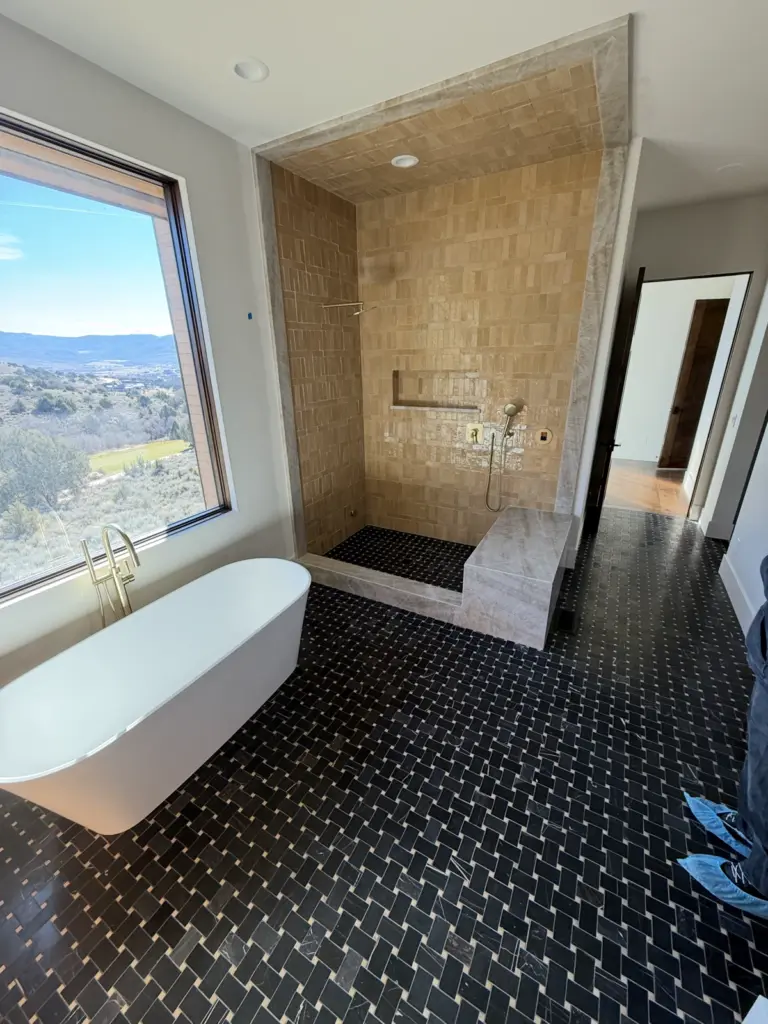 High end Luxury Tile bathroom, shower, honed marble tile flooring.